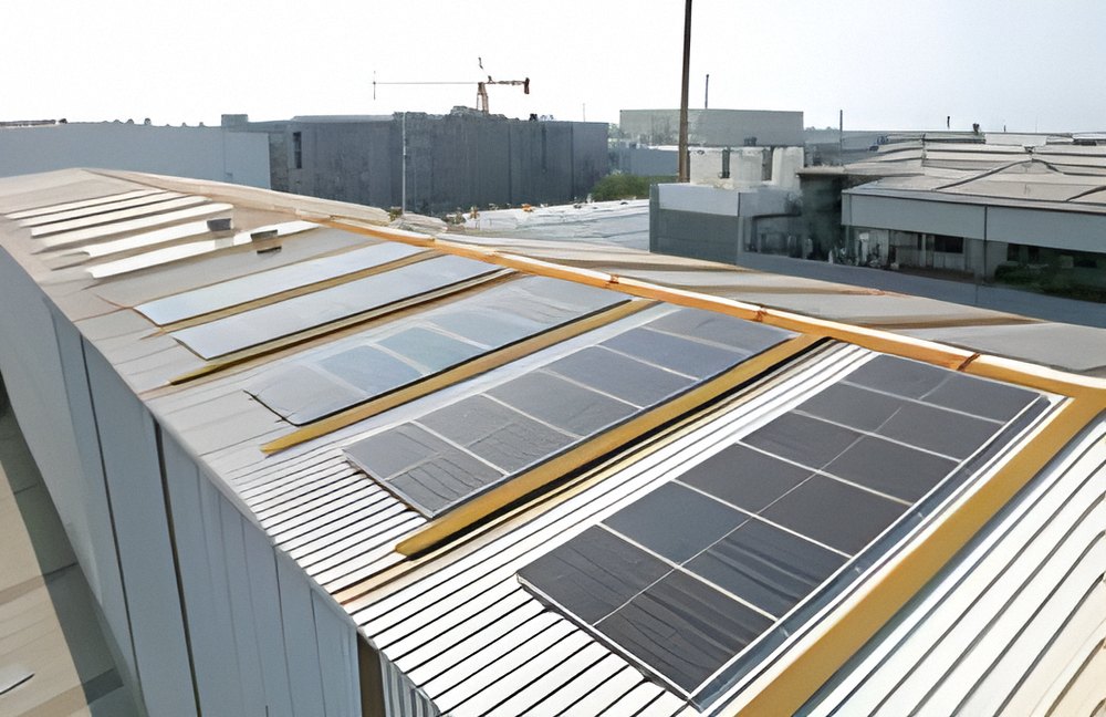 Modules on a metal-sheet industrial roof, Gujarat